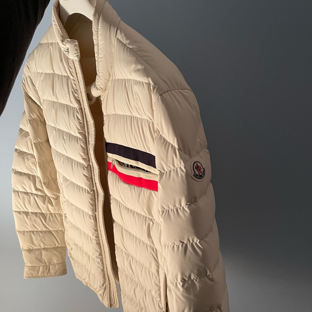Moncler Cream Puffer Jacket with Red and Black Accents